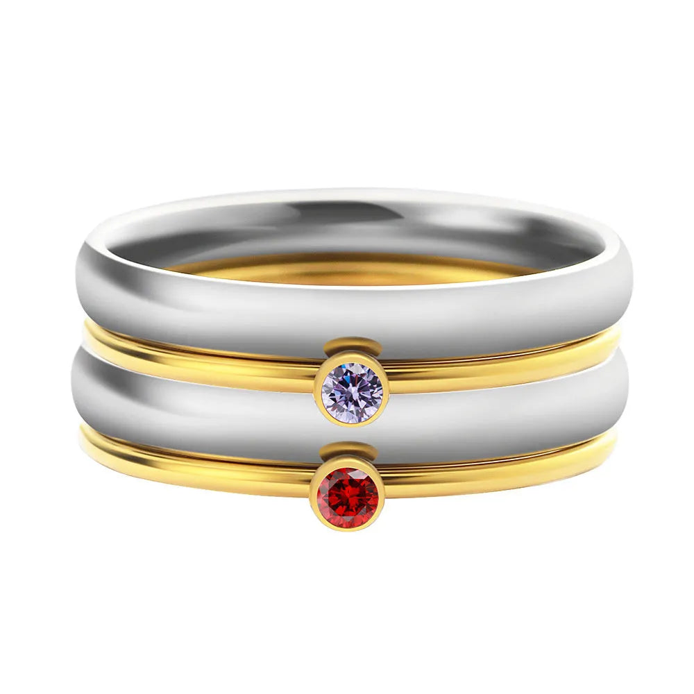 Titanium steel engraved ring with December birthstone and gold-plated steel lettering on geometric band