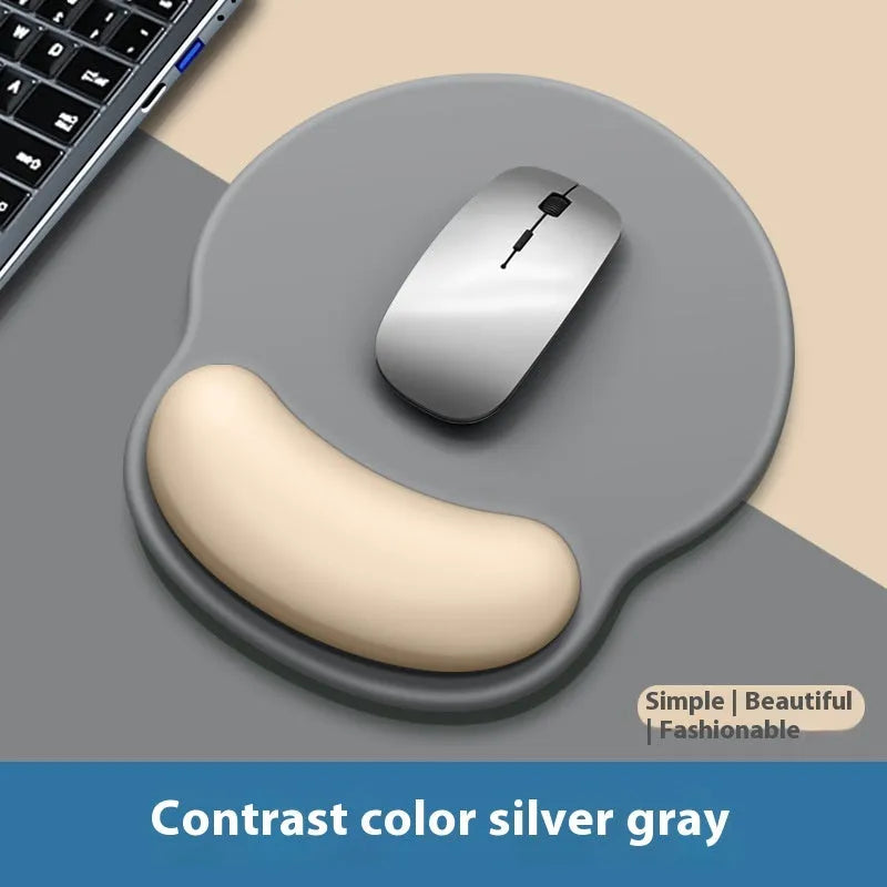 Silicone mouse mat with wrist rest in gradient colour pattern on desk