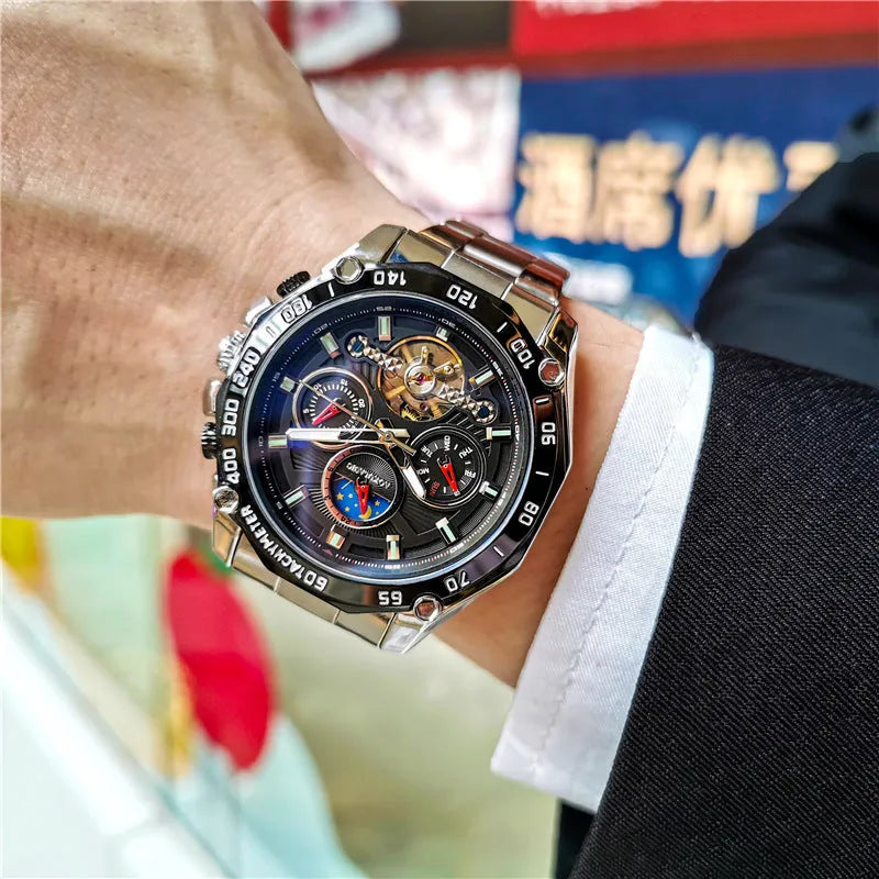 Men's automatic mechanical watch with stainless steel case on wrist, showing multi-functional dial.