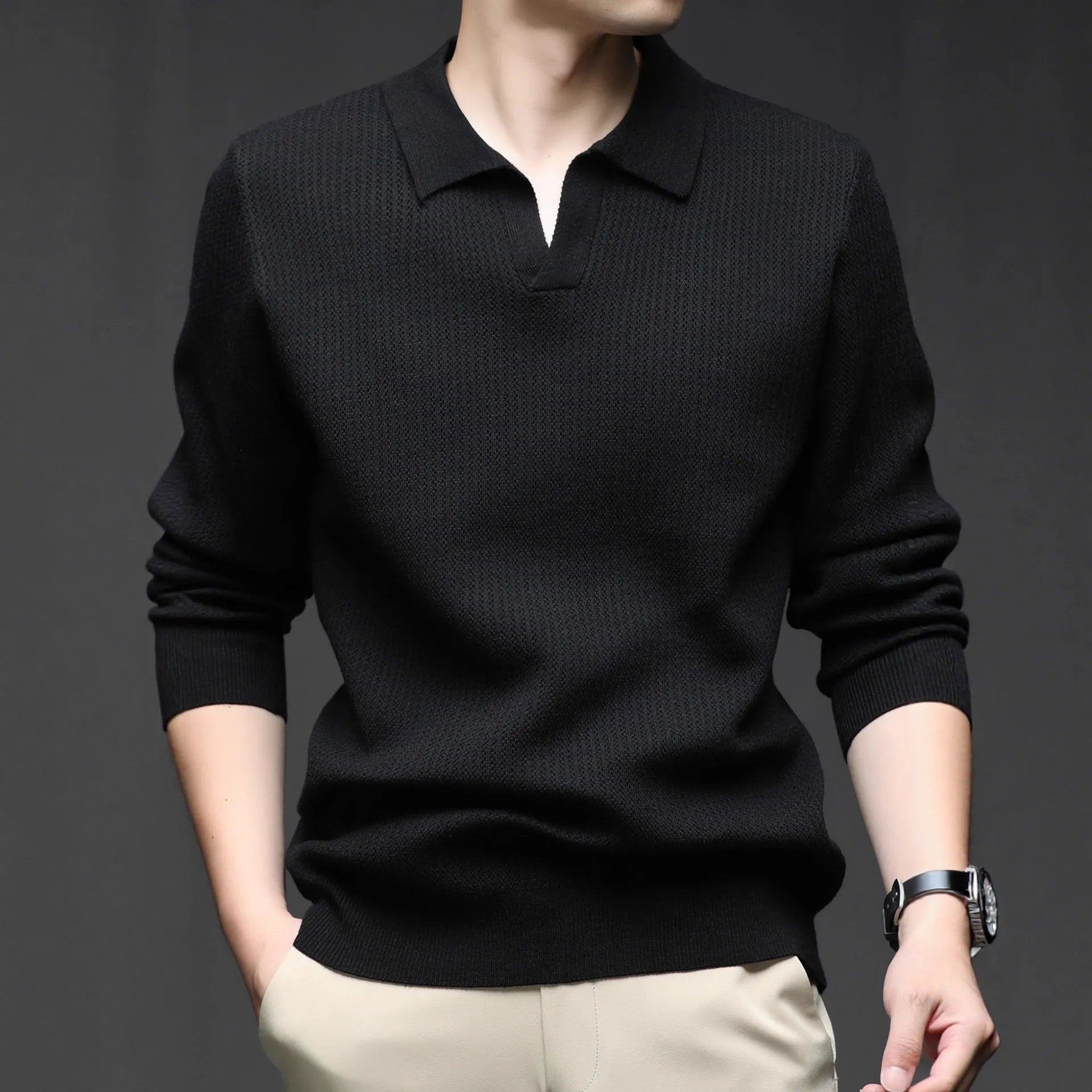 Man wearing a loose-fit green casual pullover sweater for autumn leisure.