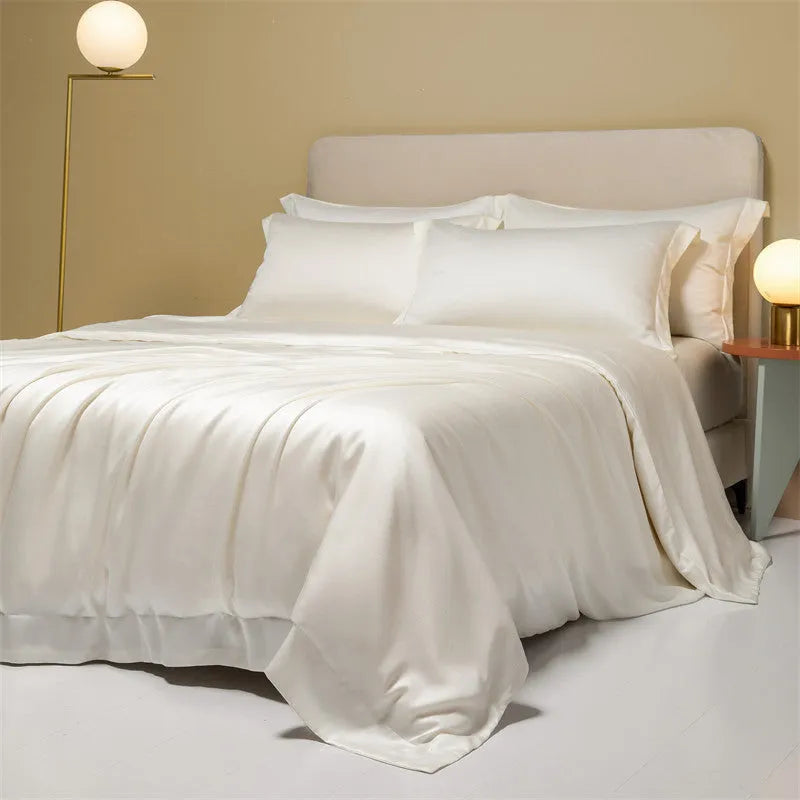 Lenzing Tencel 200 thread count bedding set in satin weave showing Aurora Blue quilt cover and pillowcases