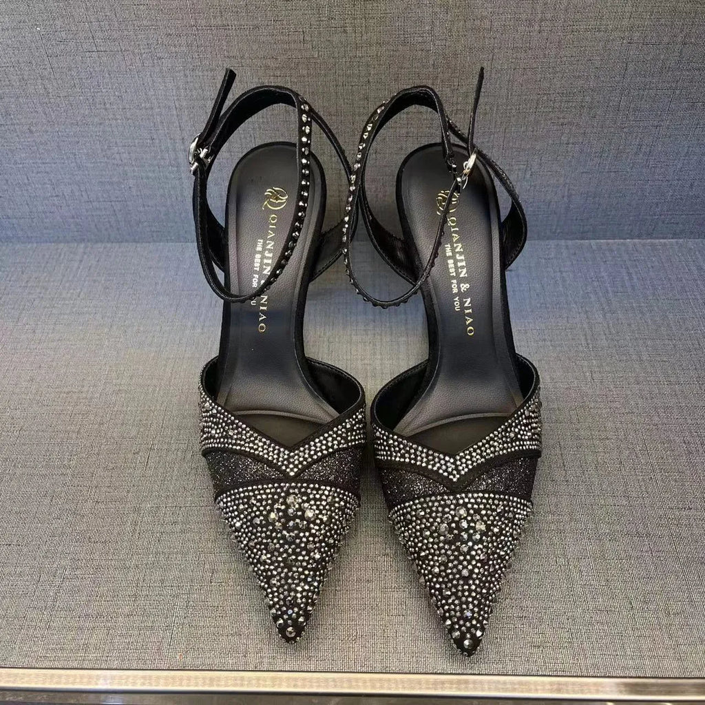 Women's silver and black hollow high heels with red sole and pointed toe design