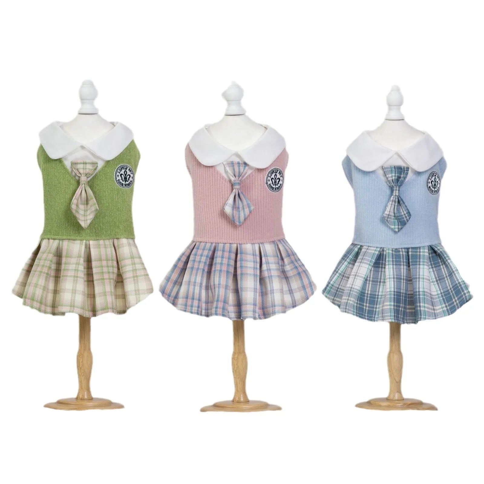 A tartan skirt for small pets in pink, blue, or green, made from polyester fabric.
