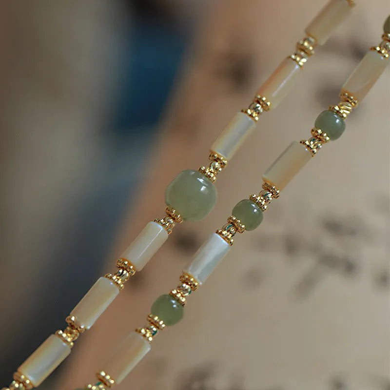 Natural Hetian jade white lip shell bracelet for women with round beads and simple geometric style