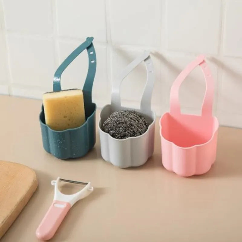 Dark blue Nordic style plastic drain basket next to a kitchen sink