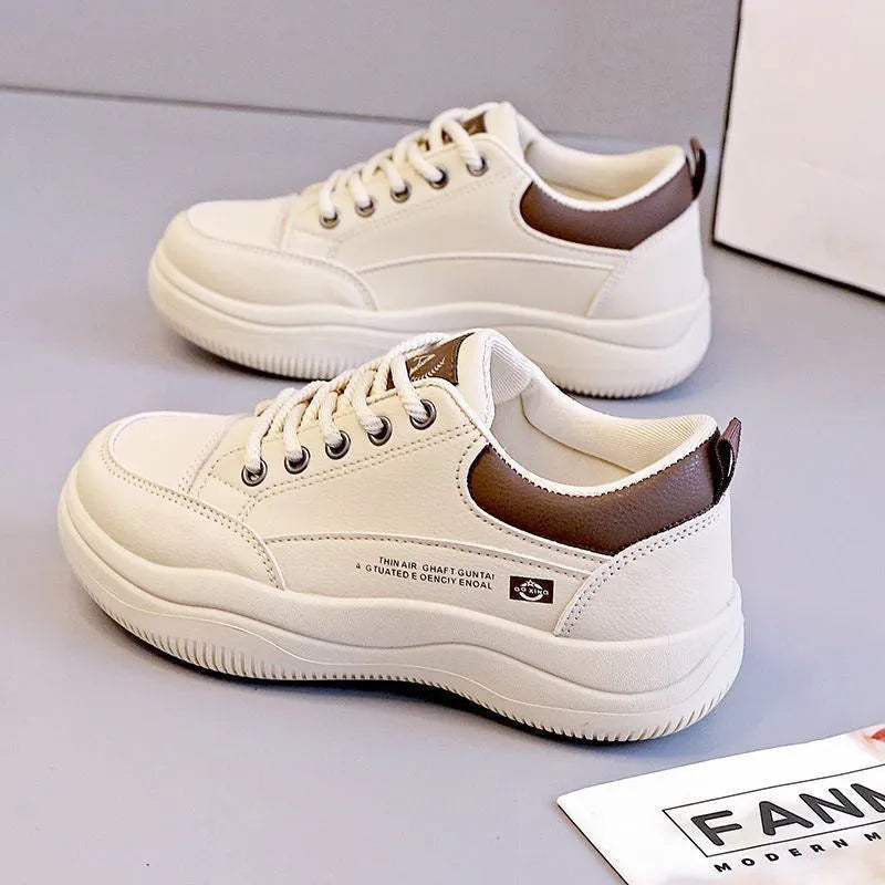 Women's white Korean-style lace-up pumps with cross straps and a flat rubber sole.