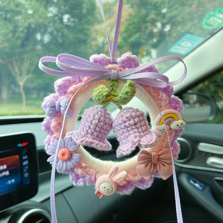 Woven wool bell orchid car pendant in green, pink, purple, or yellow, some with dream catcher.