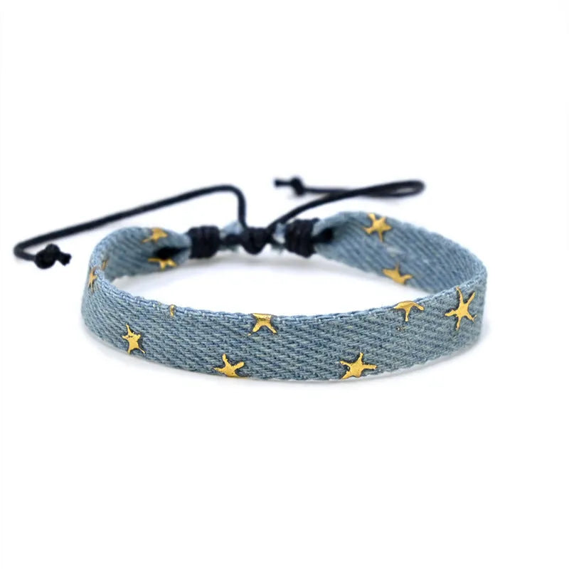 Denim fabric bracelet carrying strap in unisex design with mixed materials and cute styling
