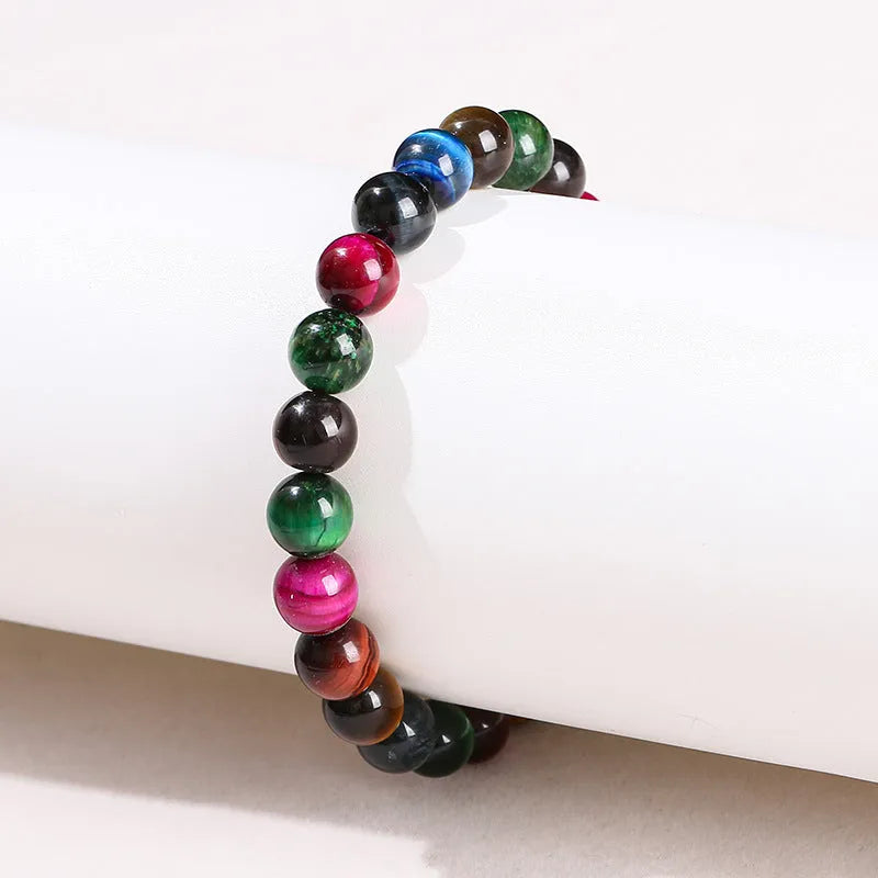 Women's colourful tiger eye stone bracelet with round beads on a string, showing size options.