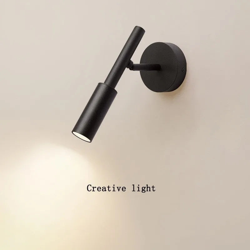 Modern wrought iron wall lamp in black or white with three colour temperature settings