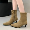 Brown square toe mid calf boots with a kitten heel and side zipper on a white background.