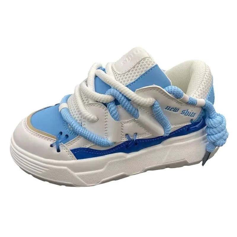 Women's grey retro platform sneakers with thick rubber sole and front lace-up closure