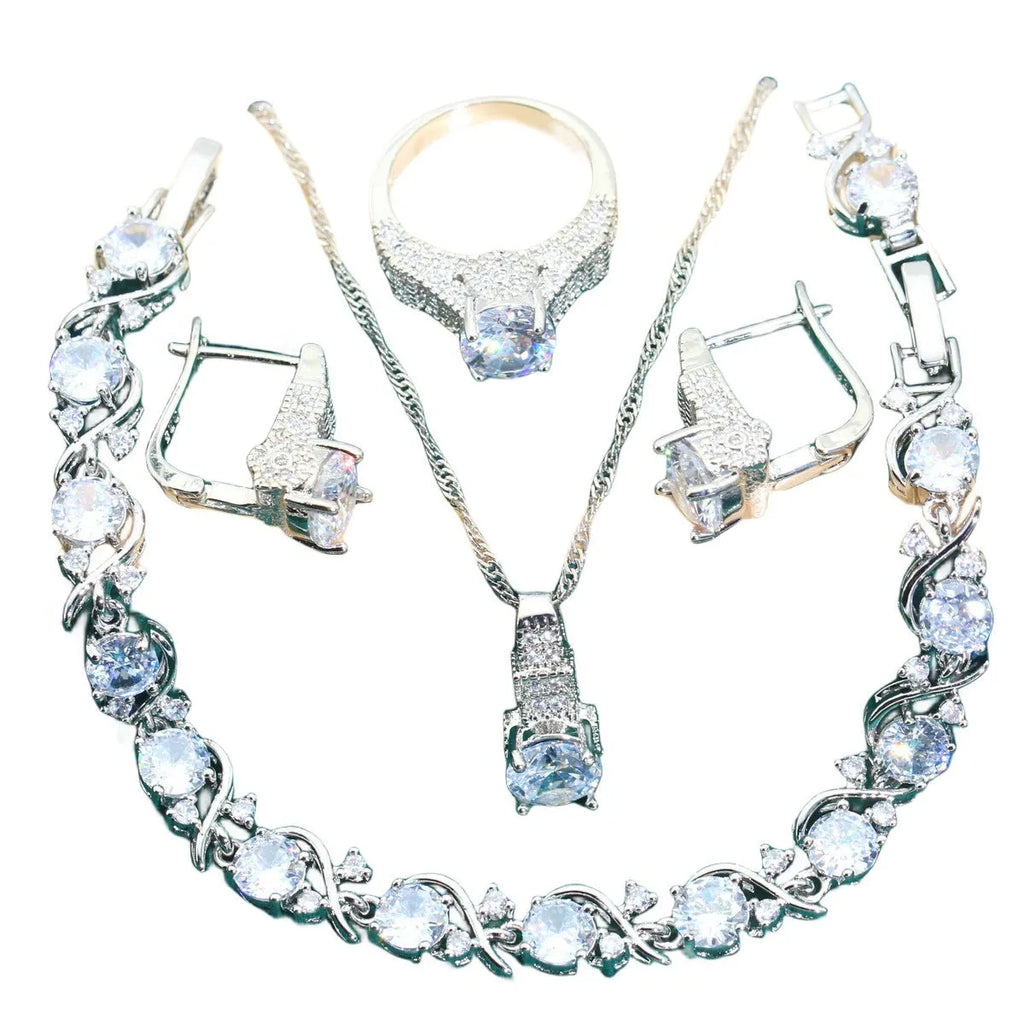 Bridal zircon four-piece jewellery set with necklace, earrings, bracelet, and ring in water wave chain style.