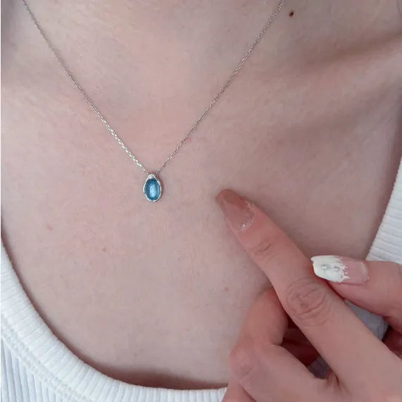 Women's navy blue geometric water drop necklace on adjustable cross chain