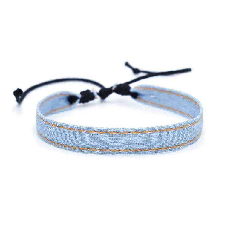 Denim fabric bracelet carrying strap in unisex design with mixed materials and cute styling