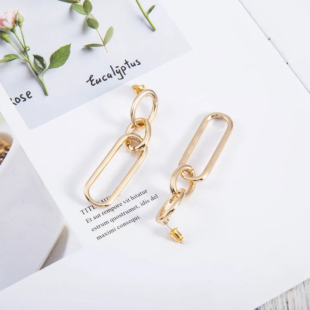 Geometric sterling silver needle hoop earrings with line and ring design elements