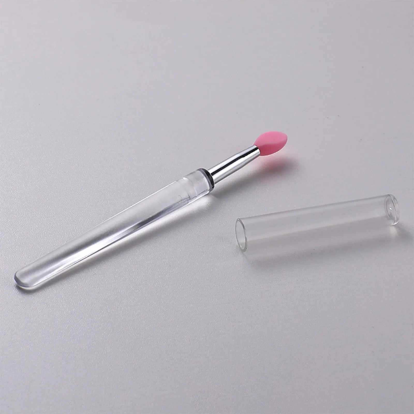 Set of silicone lip brushes with caps in various colours including blue, pink, and purple.