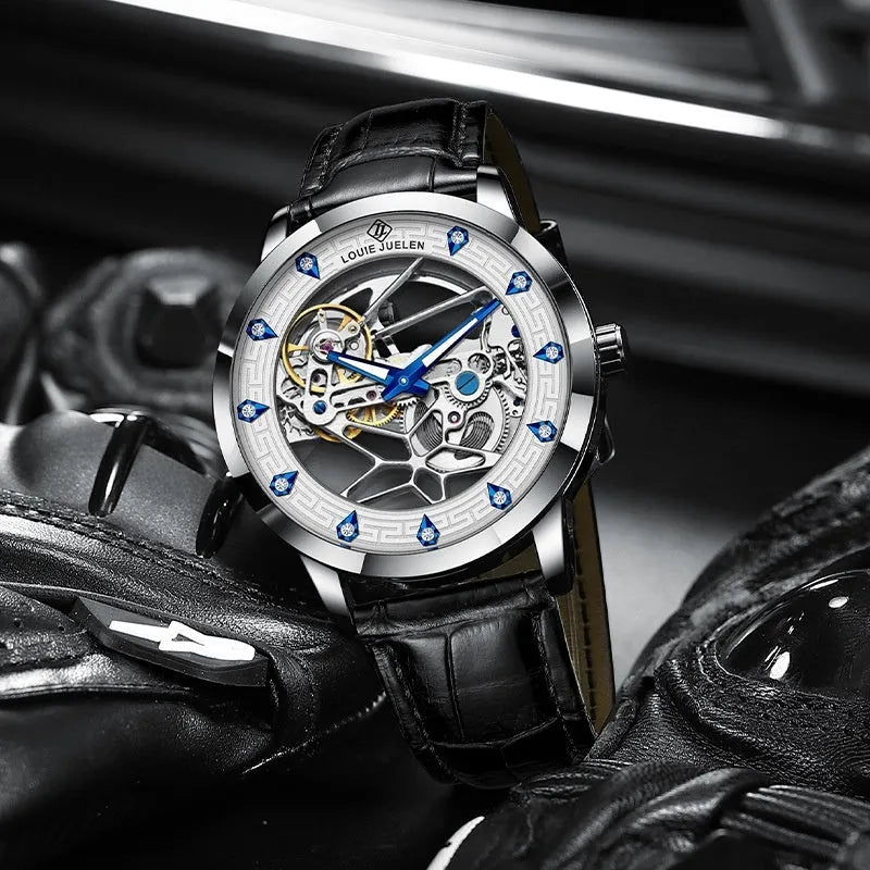 Men's silver mechanical watch with white dial, blue luminous hands, leather strap, and butterfly buckle