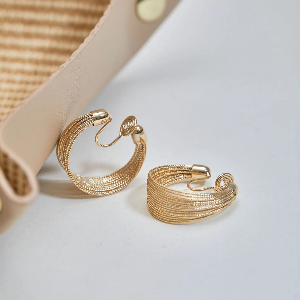 Women's geometric copper bracelet earrings with electroplated silver or gold finish in stud and clip styles