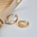 Women's geometric copper bracelet earrings with electroplated silver or gold finish in stud and clip styles