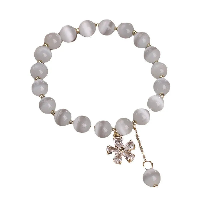 White cat's eye stone bracelet with flower tassel design and morganite safety buckle