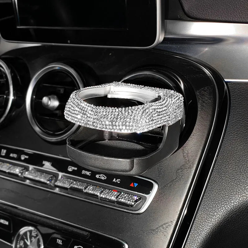 Rhinestone-decorated car cup holder bracket mounted on vehicle air vent in multiple colour options