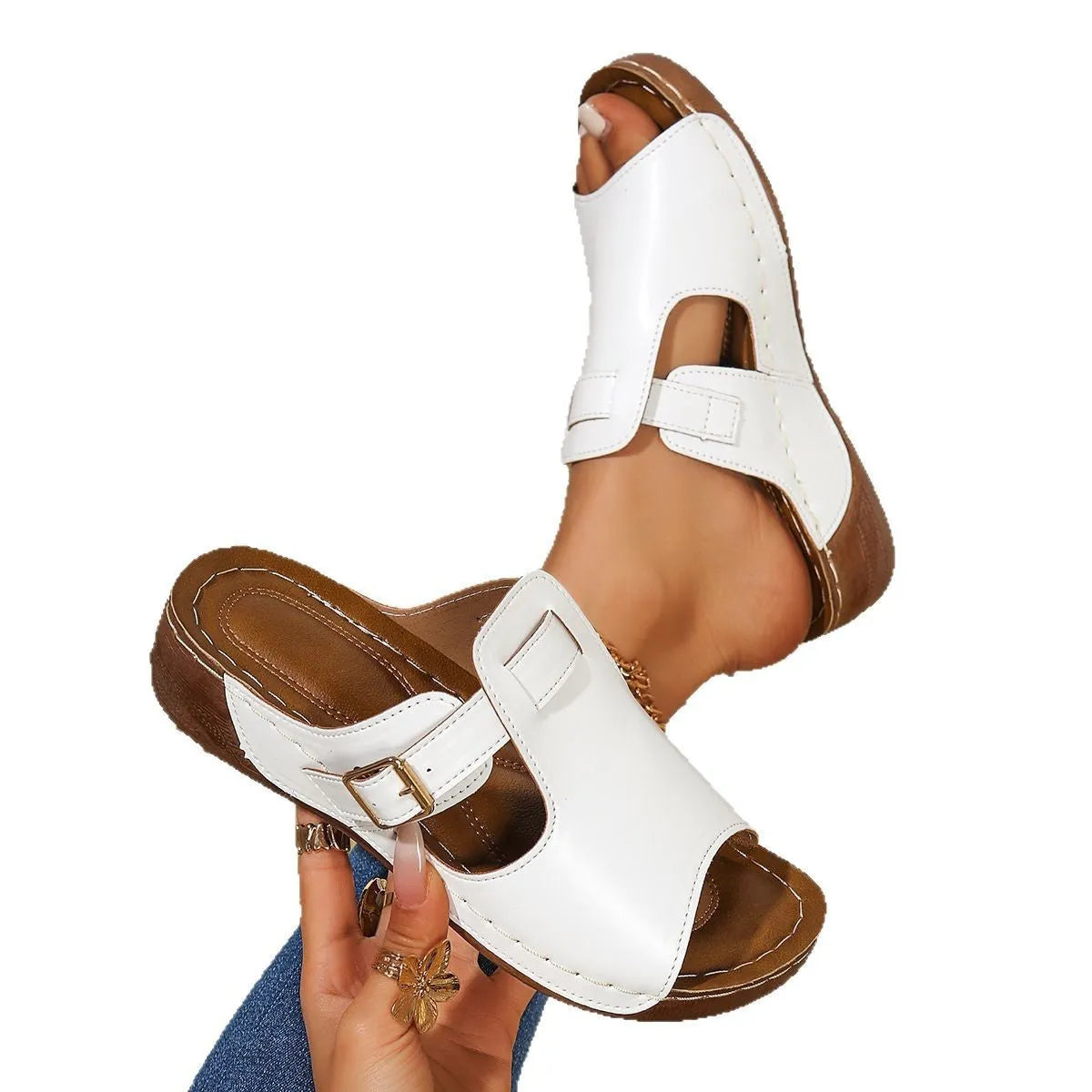 Women's light pink magic stick slippers with a fish mouth toe design on a white background.