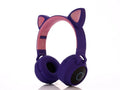 Cartoon-style head-mounted wireless Bluetooth headset with cat ears, shown in multiple colour options.
