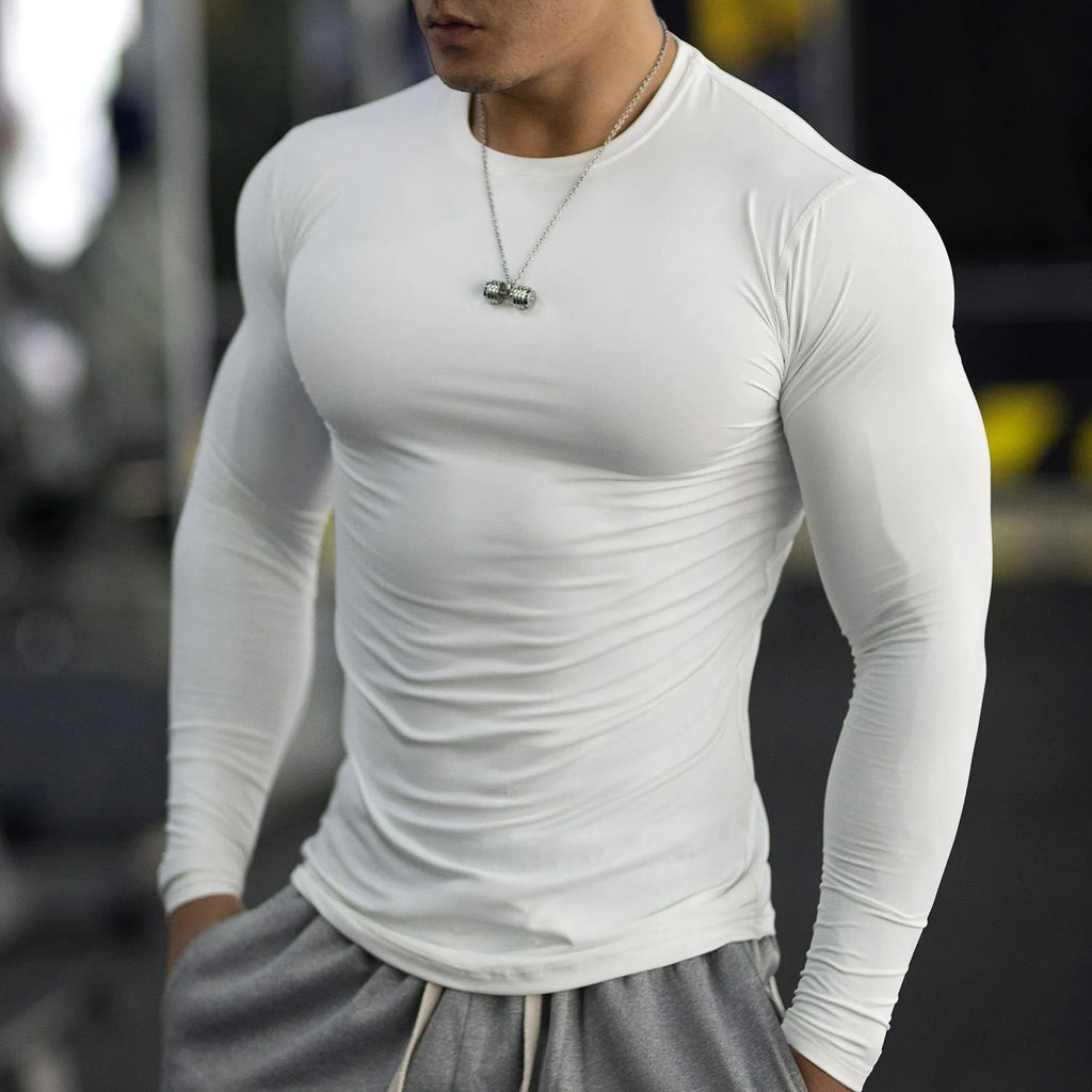 Man wearing black slim-fit long sleeve fitness tights for workout