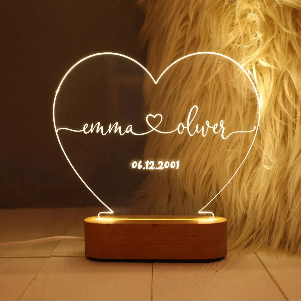 Custom transparent acrylic night light with LED base showing personalised engraving, dimensions 20cm by 11.5cm.