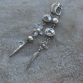 Geometric antique silver pendant earrings with XINGX design and rhinestone detailing