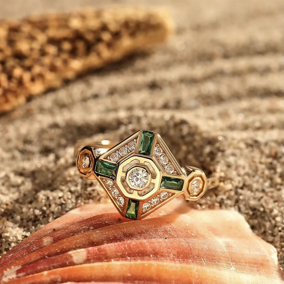 A square-cut Ins style emerald diamond ring for women on a white background.