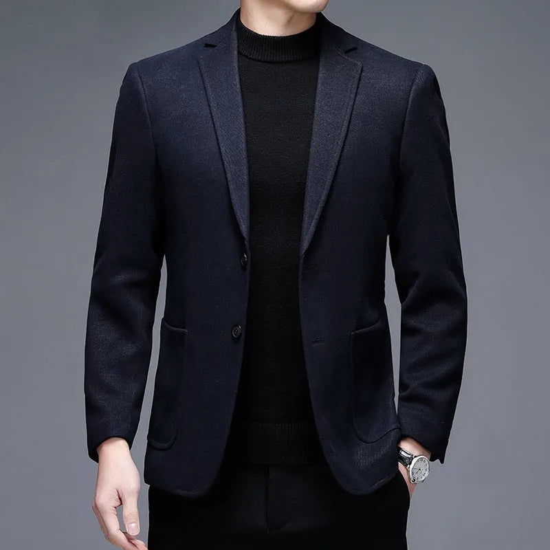 Men's loose fit wool suit jacket in solid colour showing round hem design and long sleeves