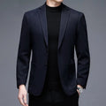Men's loose fit wool suit jacket in solid colour showing round hem design and long sleeves
