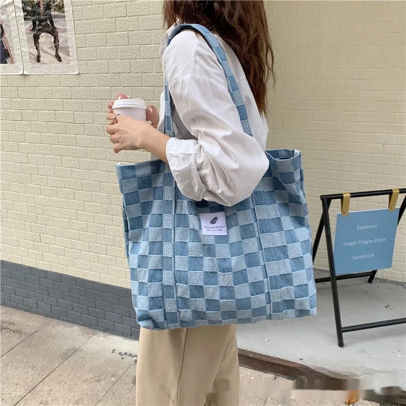 Large capacity oxford cloth women's shoulder bag with a three-dimensional front pocket.