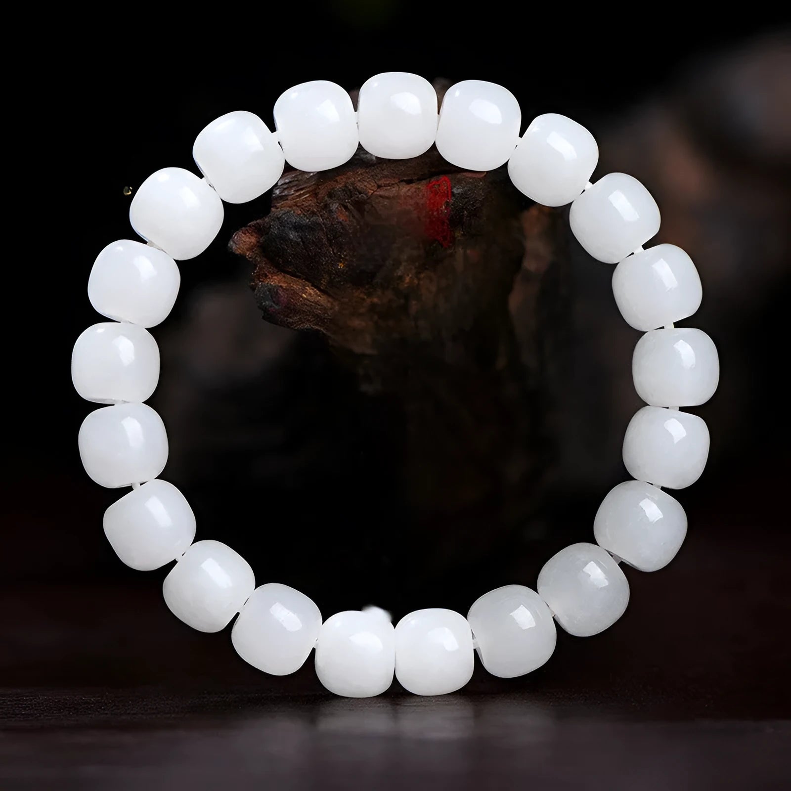 White Hetian jade barrel bead bracelet for men and women on a wrist, showing three bead size options.