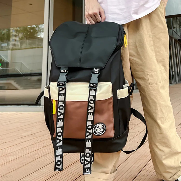 Oxford cloth backpack in black, green, or red with adjustable carrying straps.