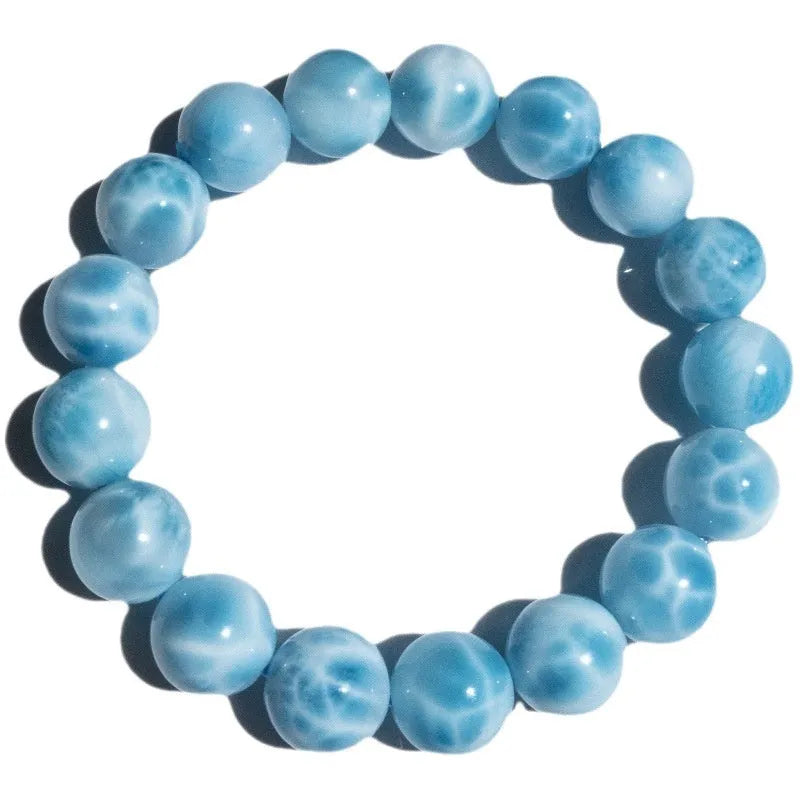 Blue natural crystal sea-pattern stone and Bodhi seed bracelet with pearl accents in Maillard style.