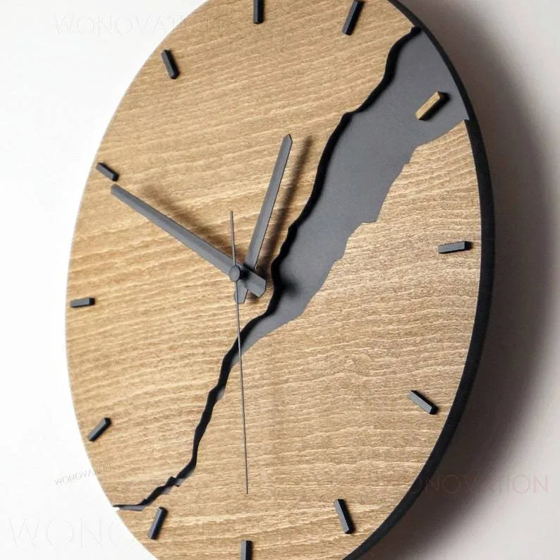 Modern simple wooden wall clock with Arabic numerals on face, shown in a neutral colour finish.