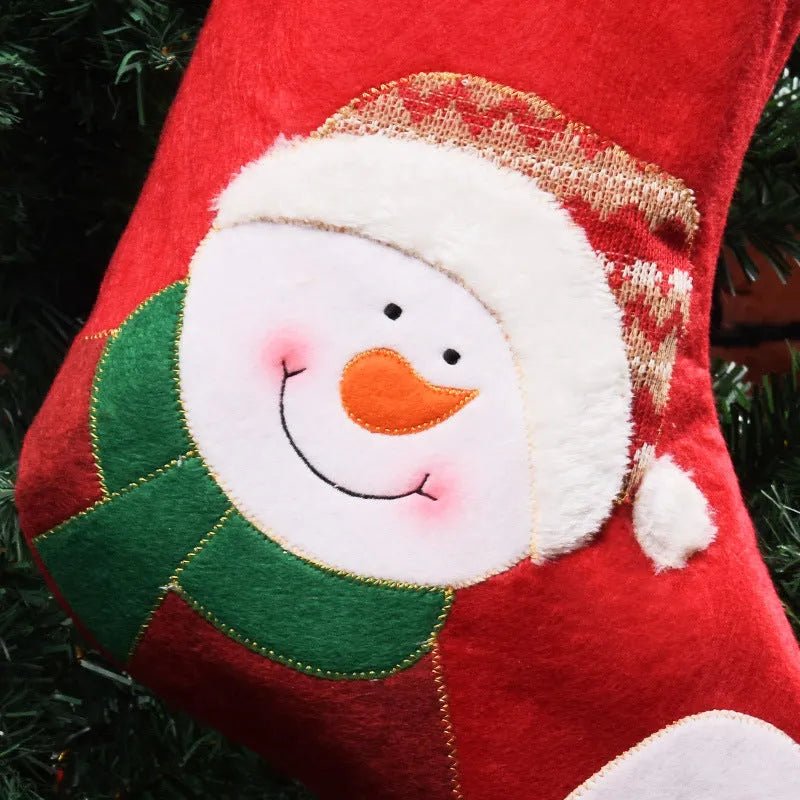 Christmas sock pendant decorations showing elk, Santa, and snowman motifs