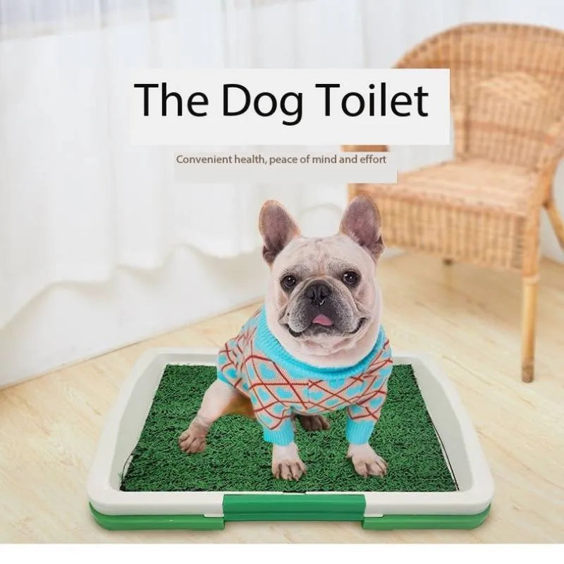 Green artificial grass dog toilet training tray with plastic base and collection basin.