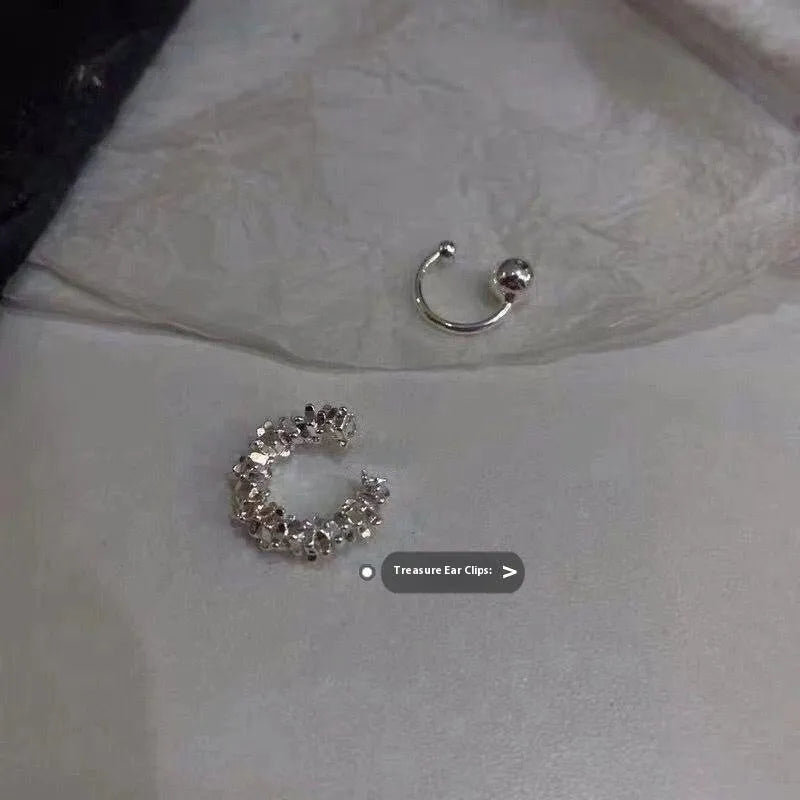 Geometric irregular shaped frosty finish alloy ear clip earrings with a double clip mechanism.