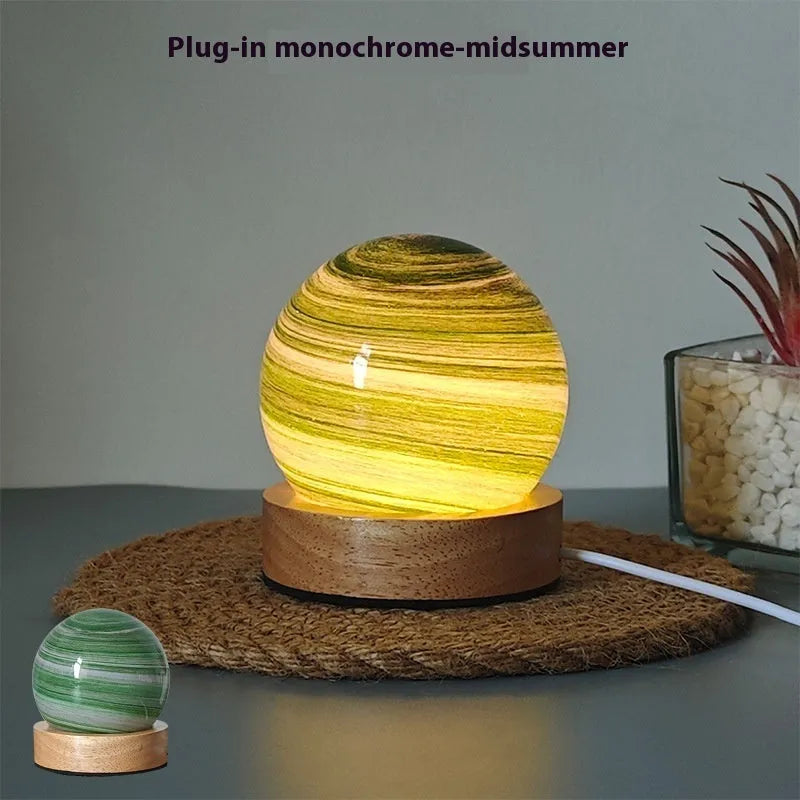 Planet-themed USB plug-in night light with three-colour dimming on a base, showing 80x90mm size.