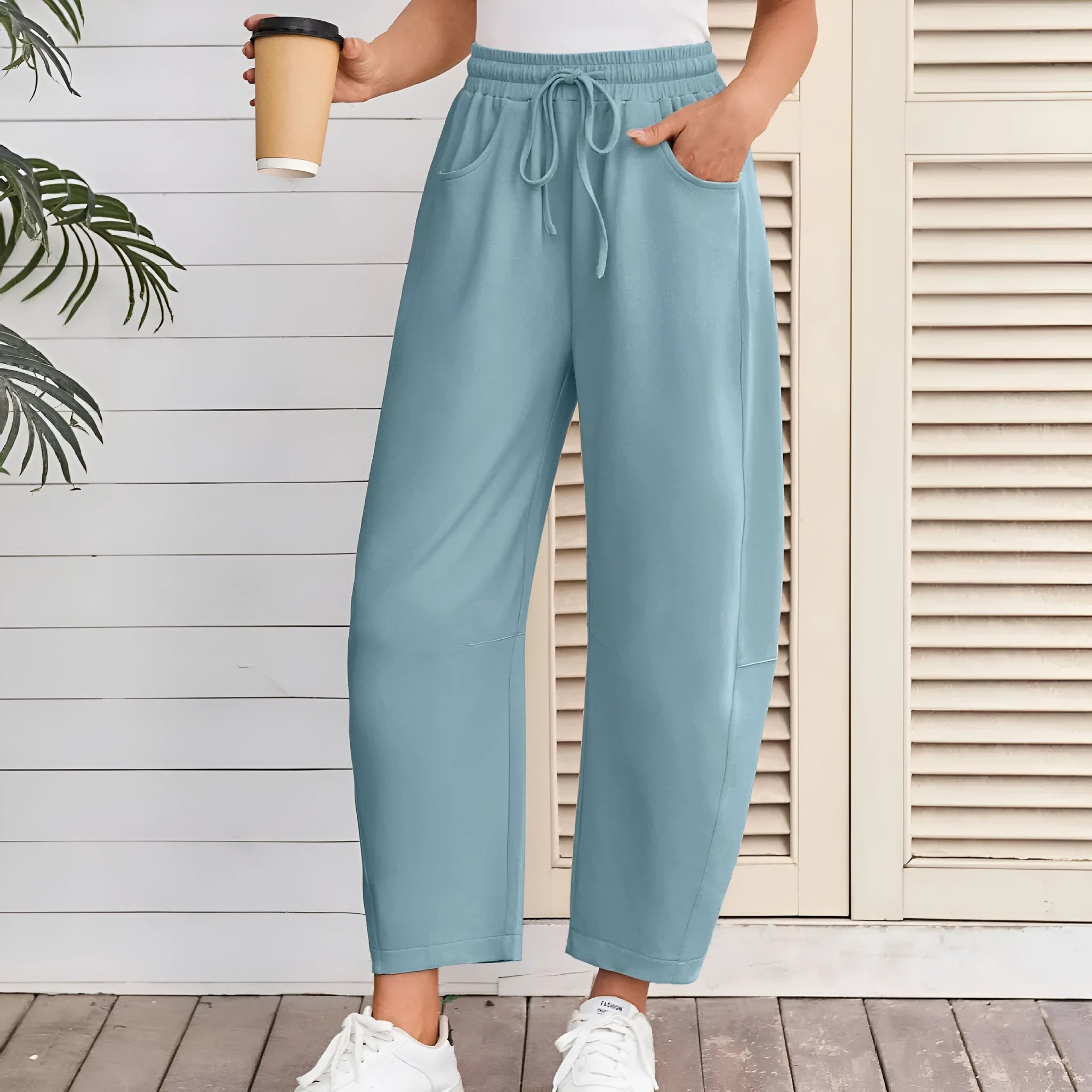 Loose cropped cotton sweatpants with elastic drawstring waist and side pockets in multiple colour options