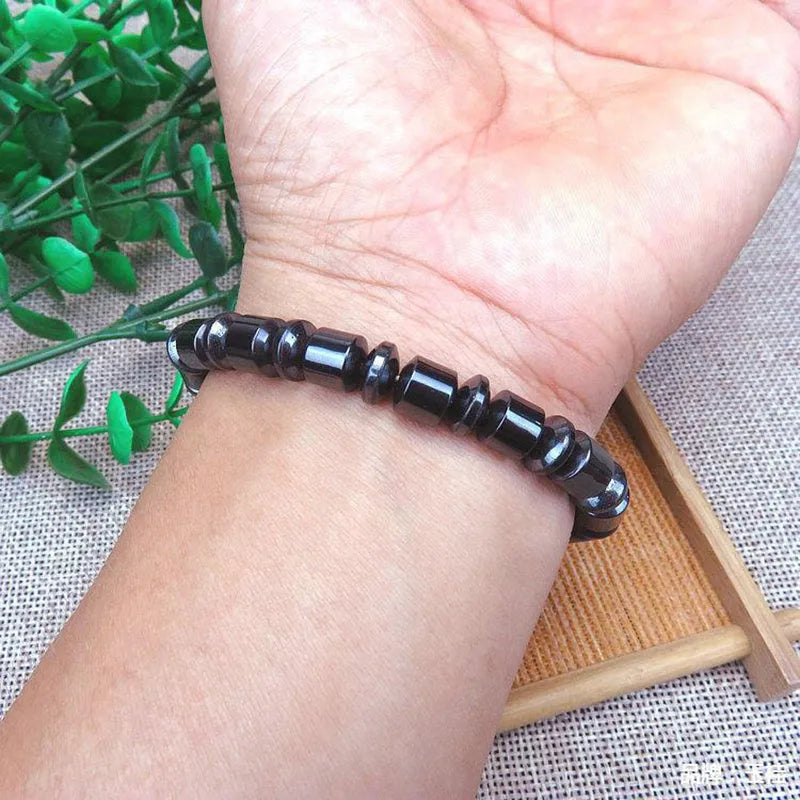 Black magnetic therapy bracelet with pentagram stone, magnetite and hematite construction, stretch design