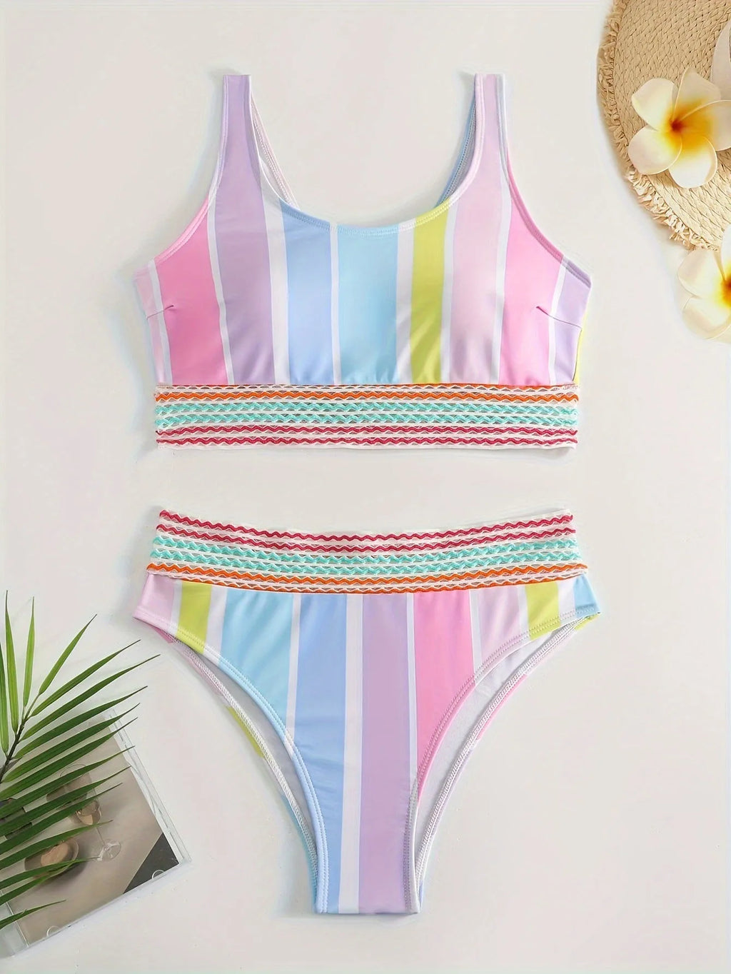 Women's striped blue and white sports bikini set on a mannequin