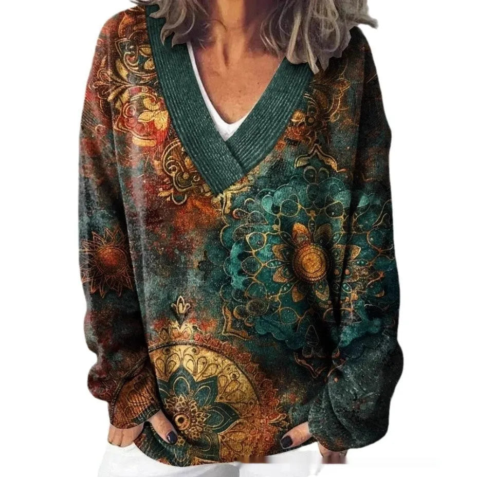 Women's white floral print V-neck sweatshirt with 3D pattern and long sleeves on a hanger.