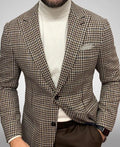 Men's black slim fit suit jacket with two buttons and large top-stitch pockets.