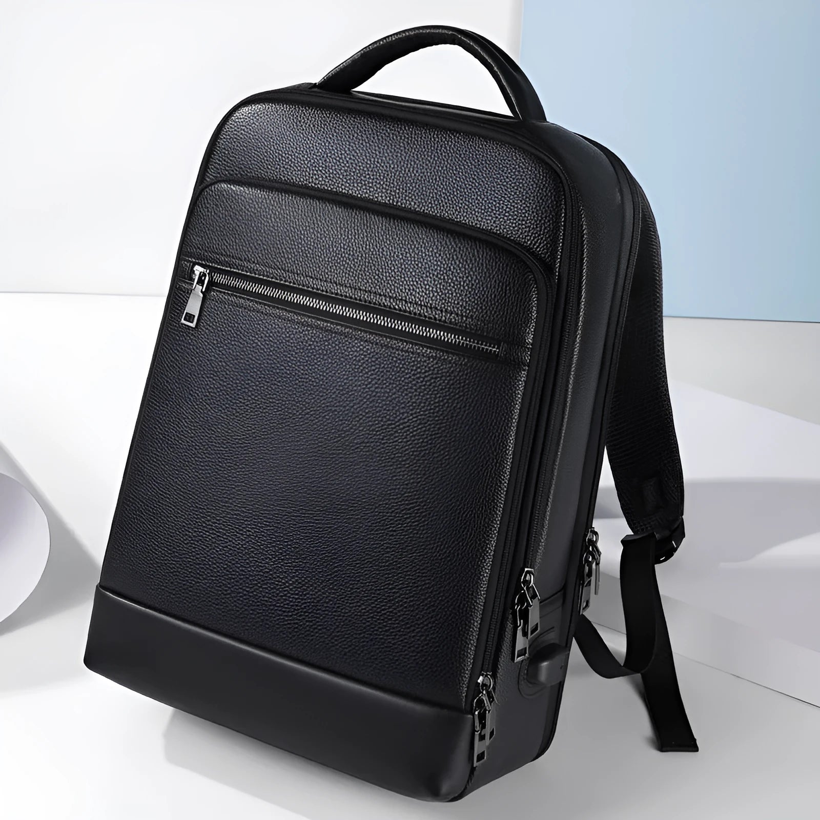 Black men's leather business backpack with curved shoulder straps and sewing line detailing