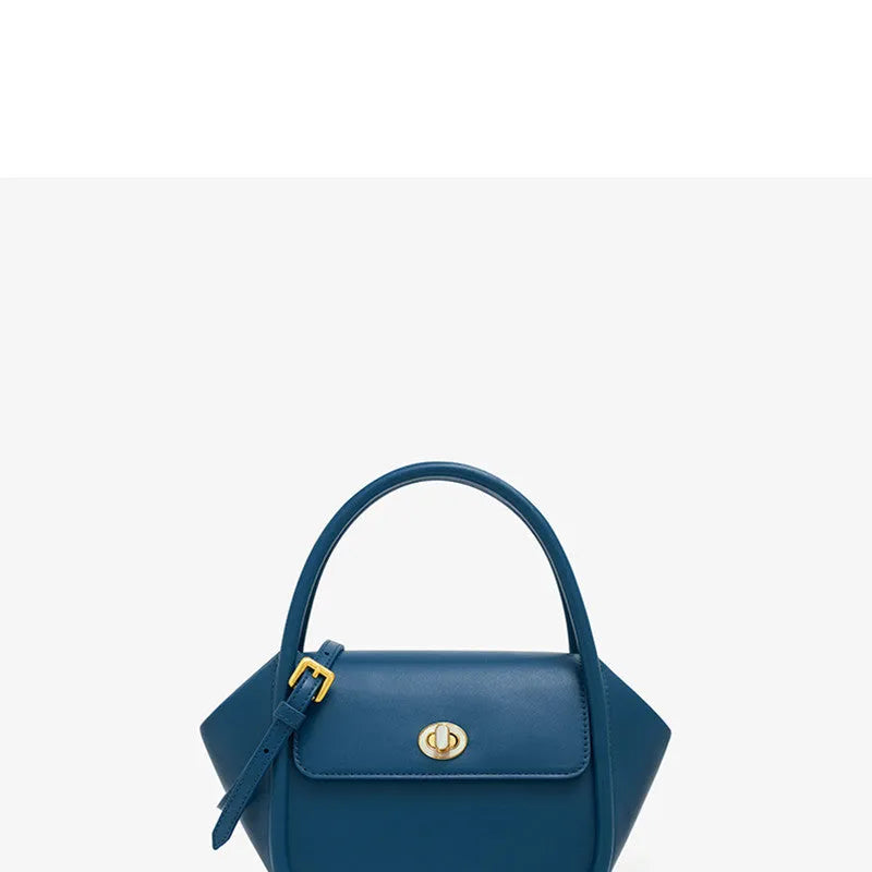 Soft cow leather wing-shaped tote handbag with a buckle and cross-body strap in four colour options.